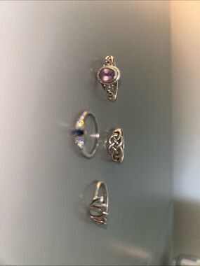 4 sterling silver rings.